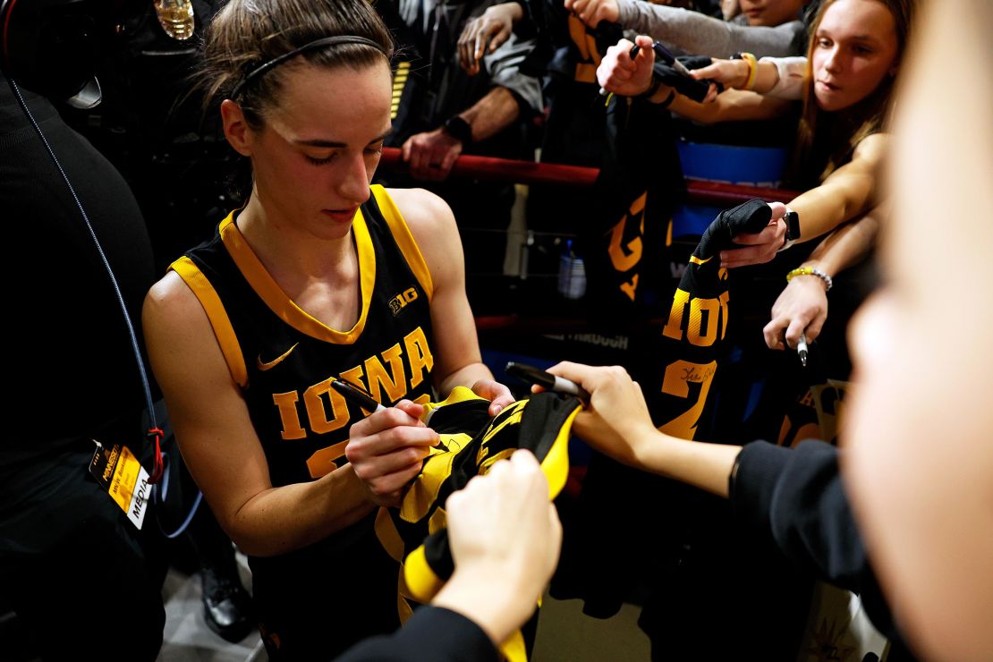 Caitlin Clark signs autographs for fans after the game against the Minnesota Golden Gophers at Williams Arena on February 28, 2024 in Minneapolis, Minnesota.