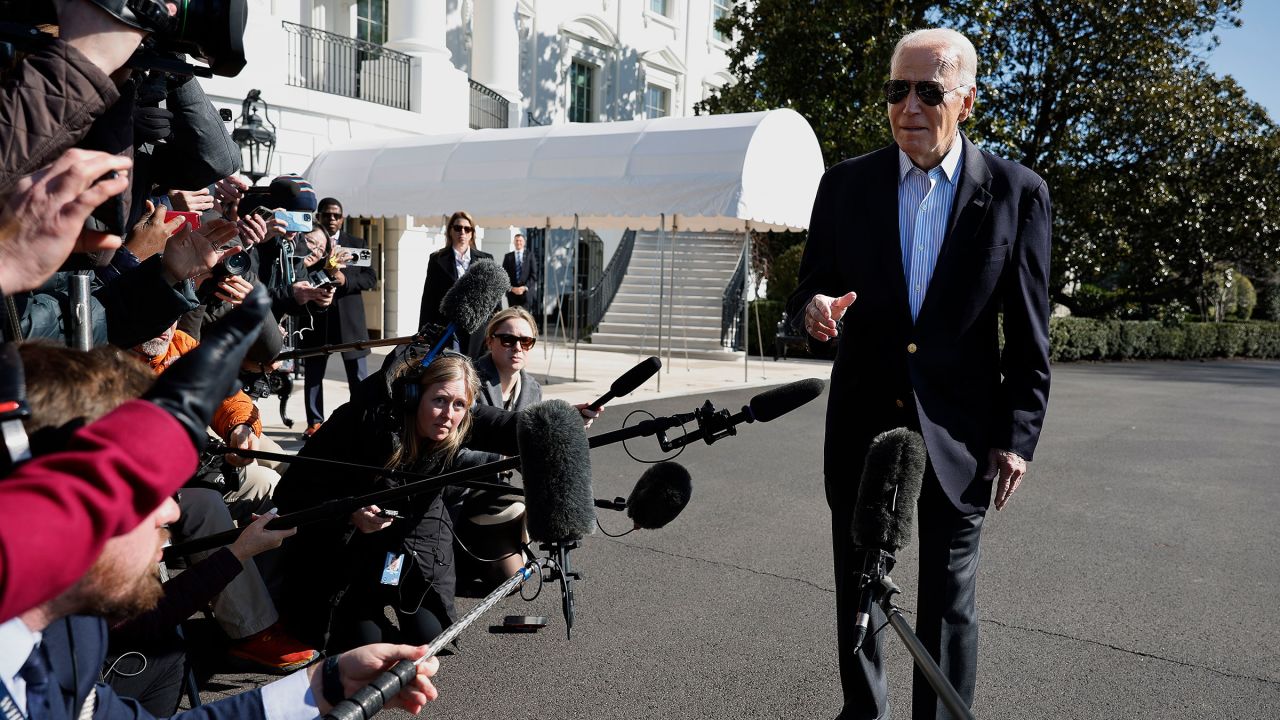 President Joe Biden speaks briefly with reporters before boarding the Marine One presidential helicopter and departing the White House on February 29 in Washington, DC.