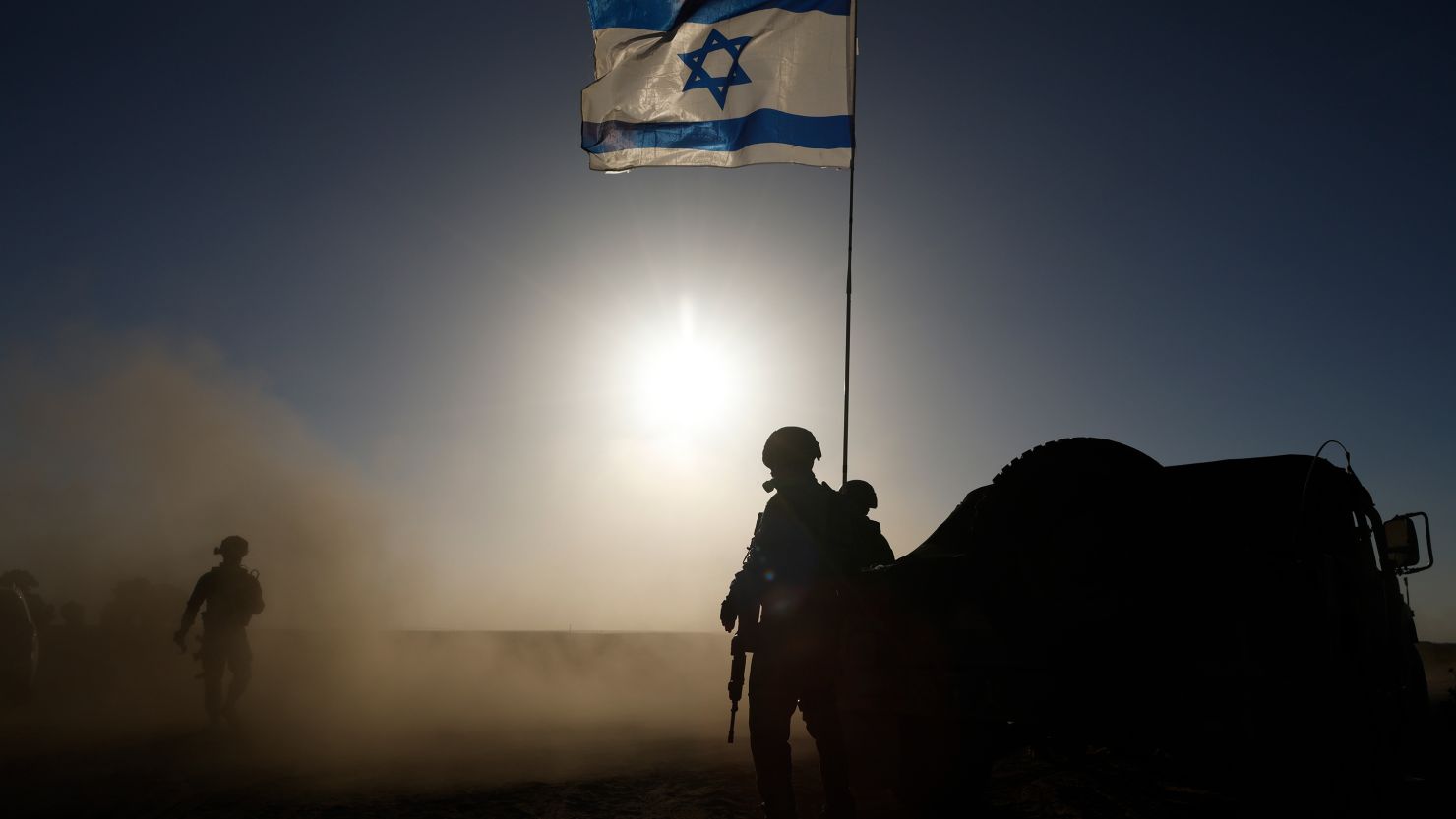 Soldiers with the Israel Defense Forces stand near a military vehicle on March 4, 2024.