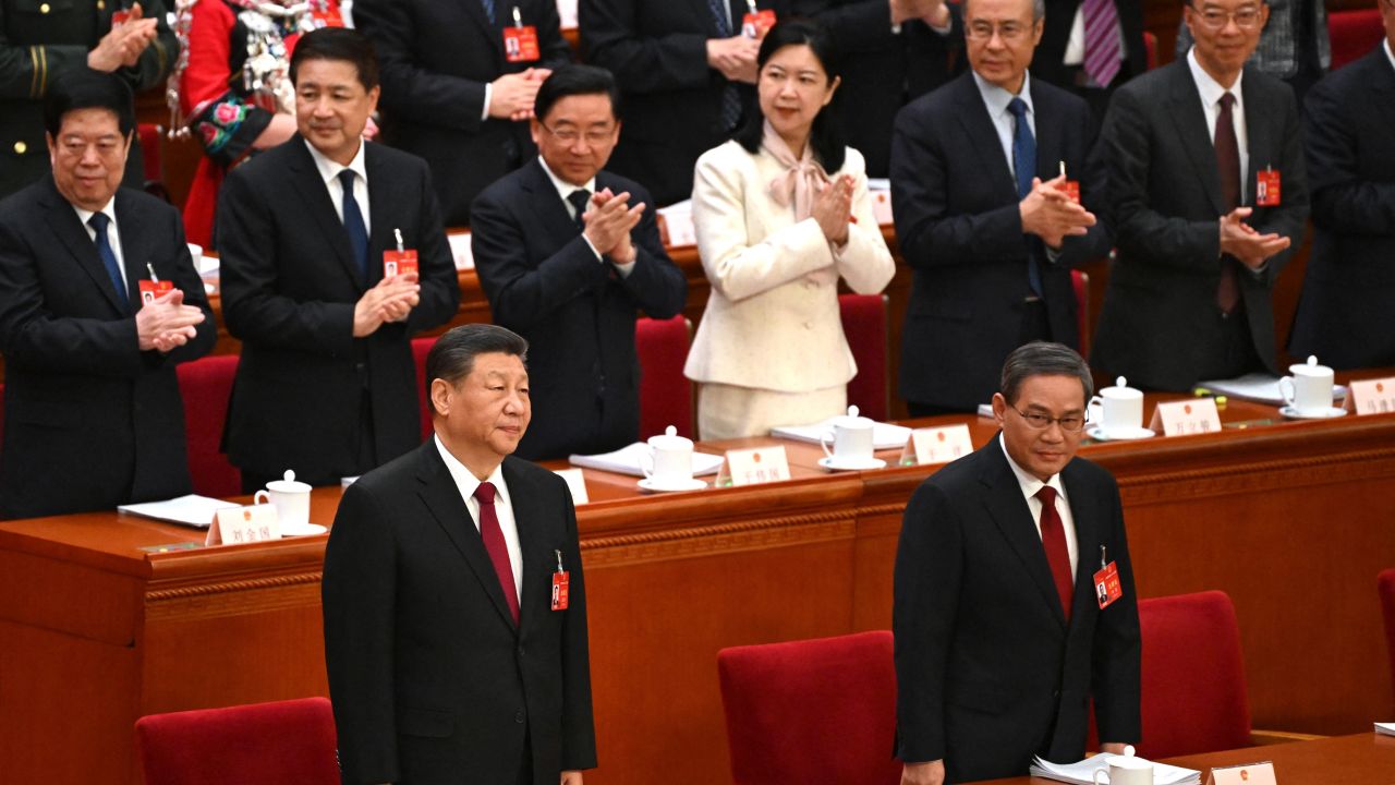 China's President Xi Jinping (front left)  and Premier Li Qiang at the opening session of the National People's Congress in Beijing