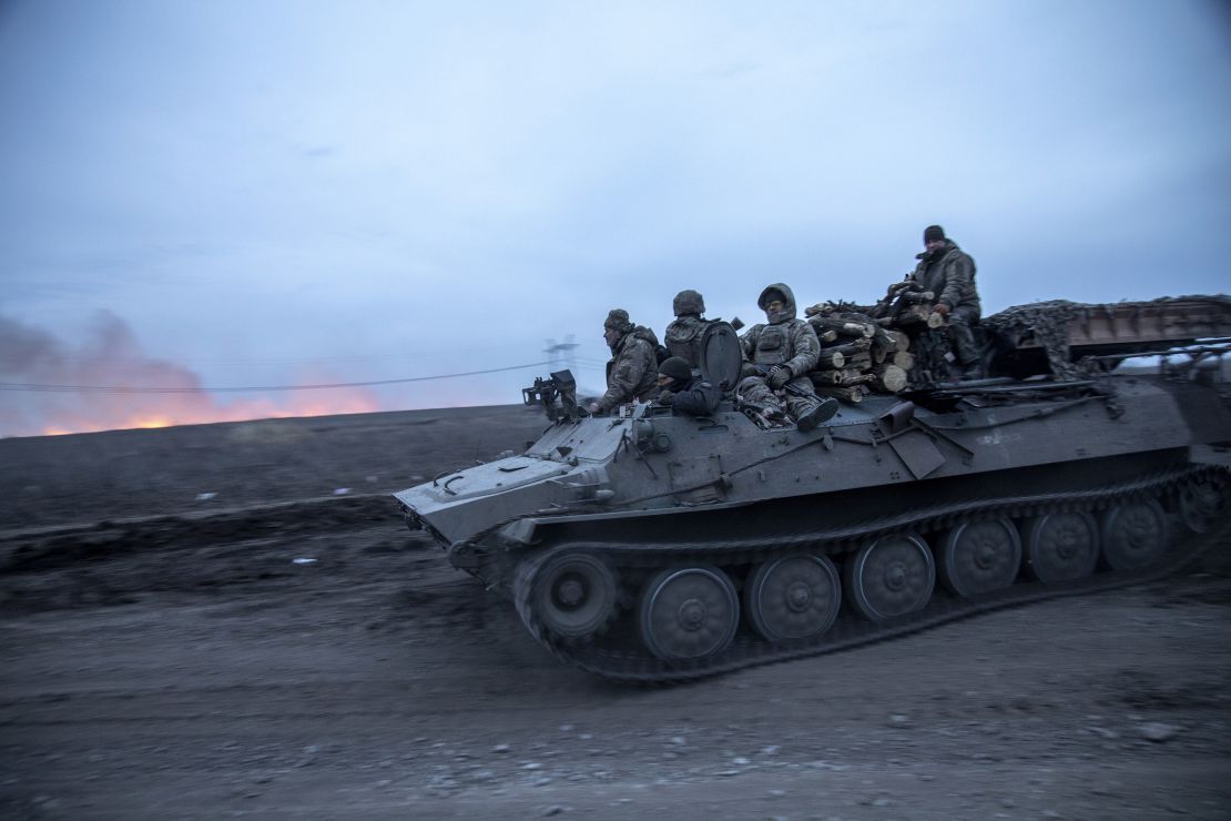 Ukrainian servicemen on an armored carrier return from the Semenivka battlefield near Avdiivka on March 4.
