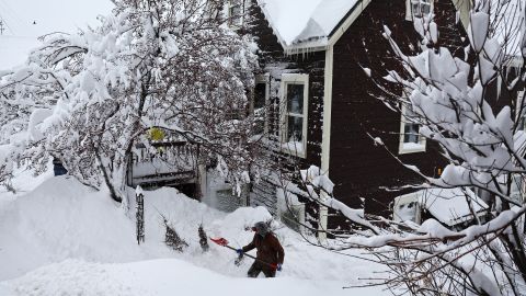 A worker digs out snow from a home north of Lake Tahoe on Saturday.
