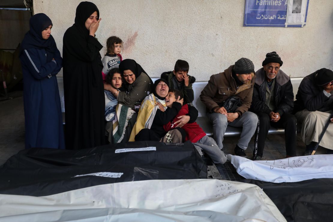 People mourn as they receive the bodies of victims of an Israeli strike on March 3, 2024, in Rafah, Gaza.