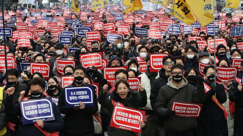 South Korean doctors participate in a rally against the government's medical policy on Sunday in Seoul, South Korea.