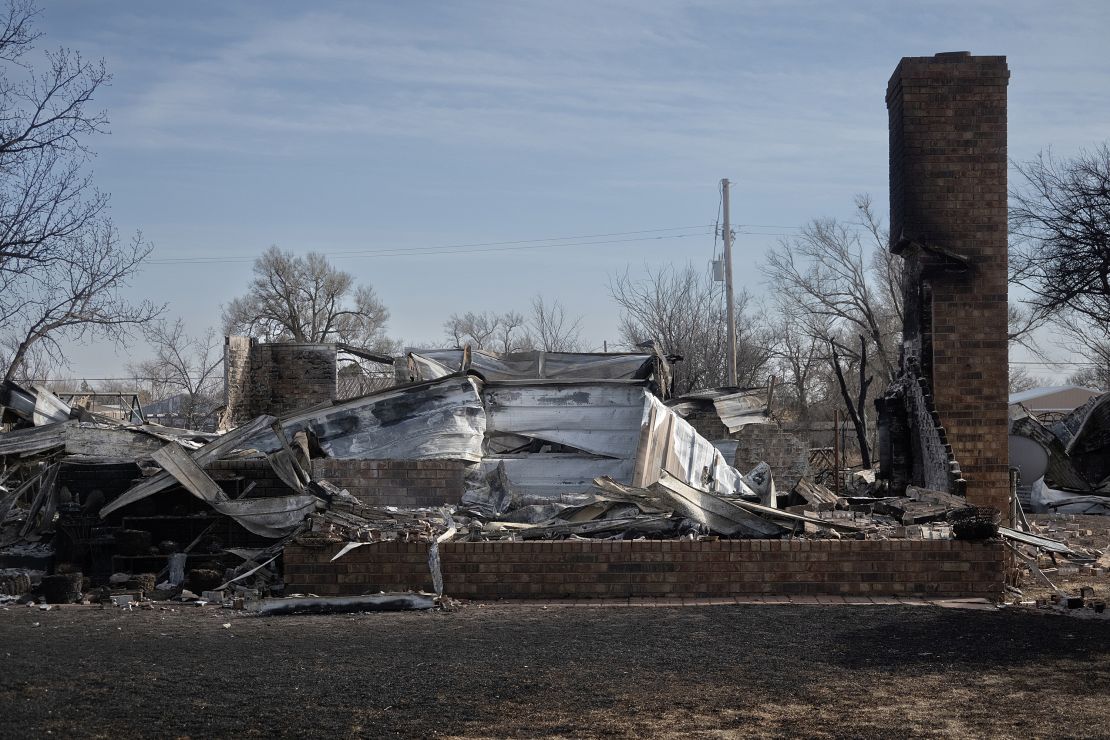 Only the chimney remains upright after a home was destroyed by the Smokehouse Creek Fire in Stinnett, Texas.