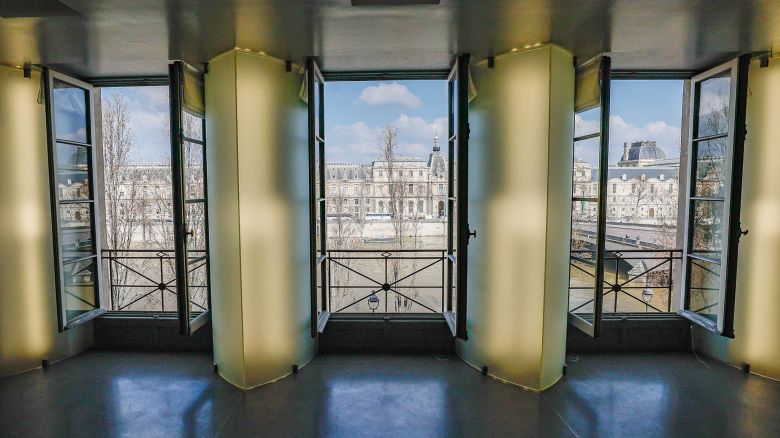 A photograph taken in Paris on March 7, 2024, shows part of the living room - with a view on the Louvre museum - of the futuristic 260 m2 three-room apartment with a 50 m2 dressing room which belonged to German fashion designer Karl Lagerfeld (1933-20219), who died in February 2019. The private Parisian apartment where Karl Lagerfeld, whose creations and catwalk showed for Chanel, Fendi and its own brand, lived a decade ago until death, will be auctioned off on March 26, 2024, the notary's office in charge of the sale announced on March 5, 2024. (Photo by ALAIN JOCARD / AFP) (Photo by ALAIN JOCARD/AFP via Getty Images)