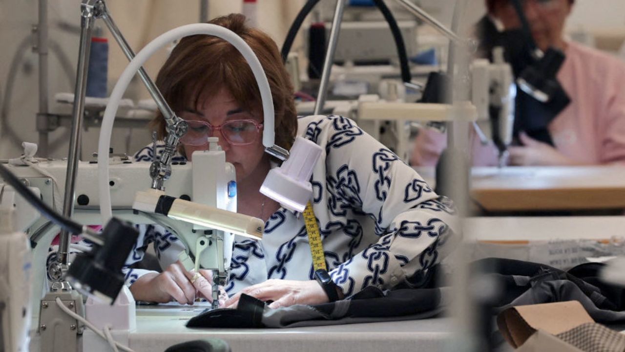 An employee works on a sewing machine on March 6, 2024 at El Hangar Design Center of Mango company, in Palau-Solita i Plegamans, 30 kms north of Barcelona. Spanish fashion retailer Mango, founded 40 years ago in Barcelona, is ramping its global expansion despite economic uncertainties that have shaken some other global mass-market apparel giants. (Photo by LLUIS GENE / AFP) (Photo by LLUIS GENE/AFP via Getty Images)