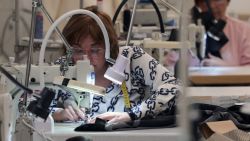 An employee works on a sewing machine on March 6, 2024 at El Hangar Design Center of Mango company, in Palau-Solita i Plegamans, 30 kms north of Barcelona. Spanish fashion retailer Mango, founded 40 years ago in Barcelona, is ramping its global expansion despite economic uncertainties that have shaken some other global mass-market apparel giants. (Photo by LLUIS GENE / AFP) (Photo by LLUIS GENE/AFP via Getty Images)