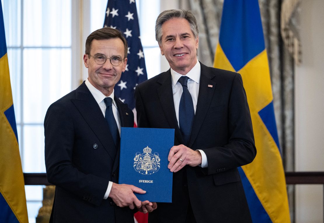 US Secretary of State Antony Blinken receives the NATO ratification documents from Swedish Prime Minister Ulf Kristersson during a ceremony at the US State Department on March 7, 2024.
