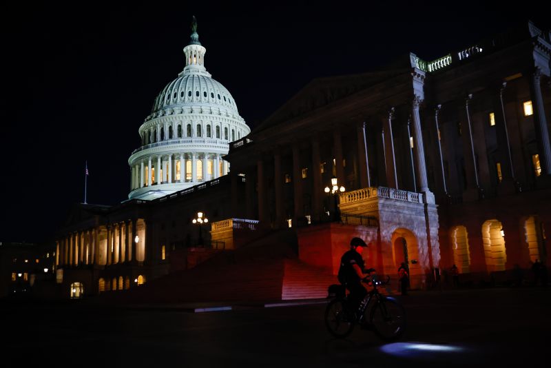 A police officer outside the US Capitol in Washington, DC, US, on Thursday, March 7, 2024. Election-year politics will increase the focus on President Joe Biden's State of the Union address and lawmakers' reactions, as he's stumping to the nation just months before voters will decide control of the House, Senate, and White House. Photographer: Julia Nikhinson/Bloomberg via Getty Images