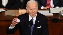 US President Joe Biden holds a "Say her name Laken Riley" button while delivering the State of the Union address in the House Chamber of the US Capitol in Washington, DC, on March 7, 2024. (Photo by SAUL LOEB / AFP) (Photo by SAUL LOEB/AFP via Getty Images)