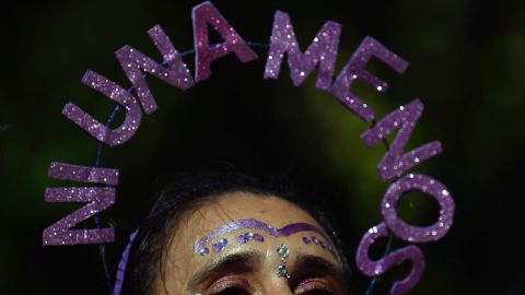 A woman wears a head ornament with the legend "Ni una menos (not one less)" during a march to mark the International Women's Day in Buenos Aires, on March 8, 2024. (Photo by Luis ROBAYO / AFP) (Photo by LUIS ROBAYO/AFP via Getty Images)