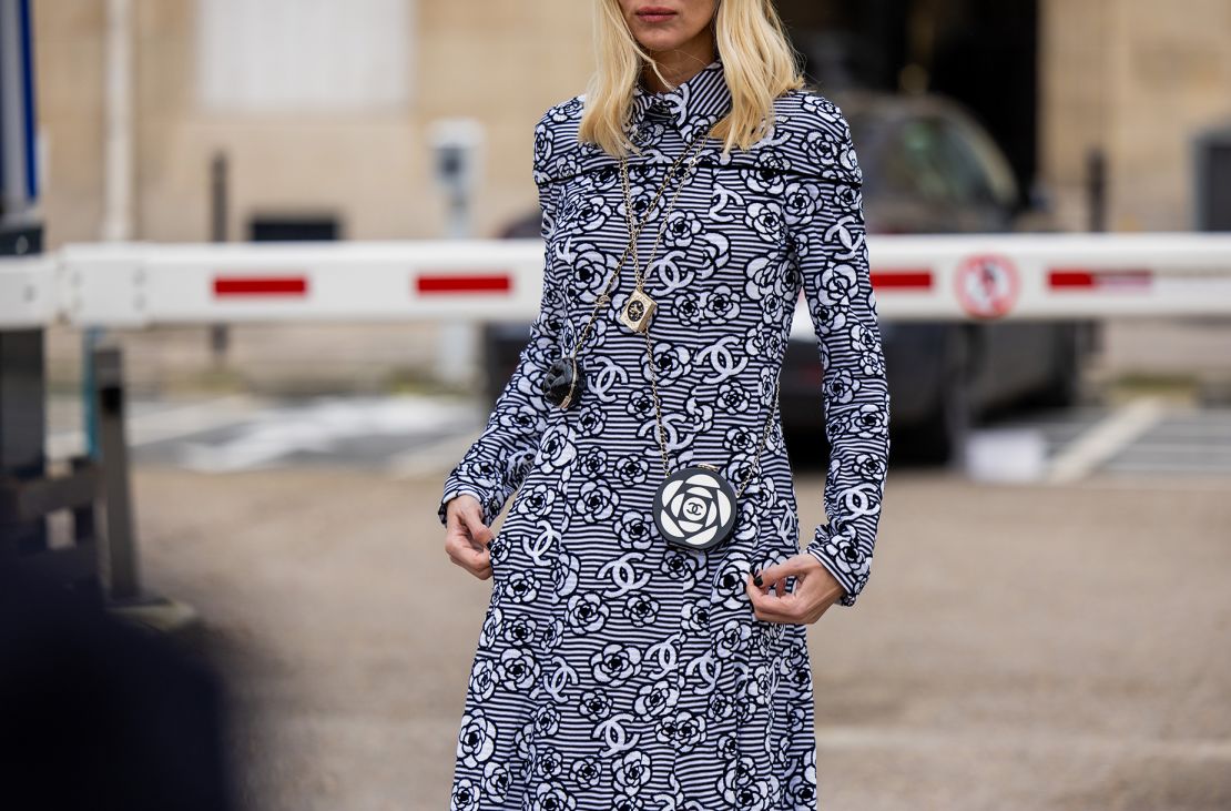 As they move to protect their intellectual property, big brands are coming into conflict with a growing class of up-and-coming designers working with refashioned designer gear. Here, a showgoer at Paris Fashion Week in a Chanel dress.