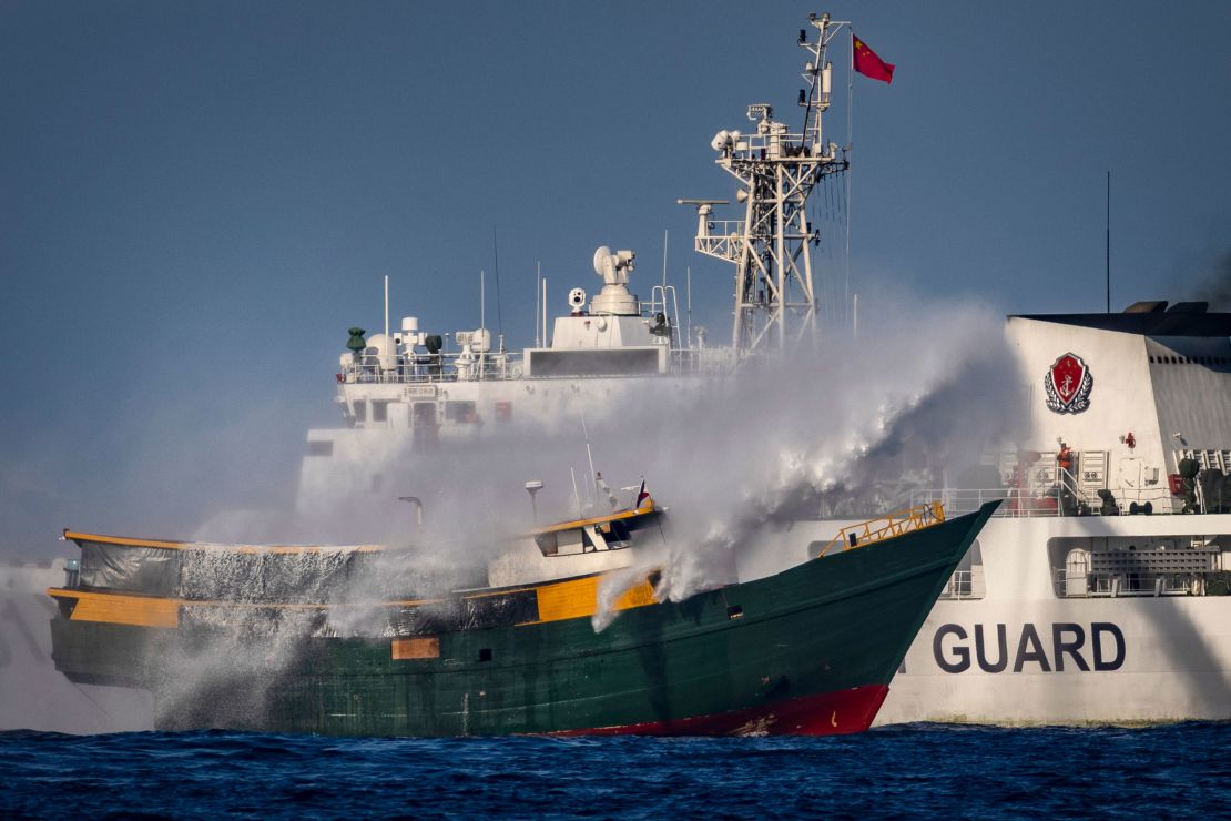 China Coast Guard vessels fire water cannons toward a Philippine resupply vessel at Second Thomas Shoal in the South China Sea on March 5.