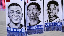 MADRID, SPAIN - MARCH 06: Scarves of Kylian Mbappe, Jude Bellingham and Vinicius Jr.hang in a souvenir stall outside the stadium prior to the UEFA Champions League 2023/24 round of 16 second leg match between Real Madrid CF and RB Leipzig at Estadio Santiago Bernabeu on March 06, 2024 in Madrid, Spain. (Photo by David Ramos/Getty Images)