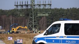 GRUENHEIDE, GERMANY - MARCH 07: A police van stands near an electricity pylon that delivers electricity to the nearby Tesla factory and that was recently sabotaged on March 07, 2024 near Gruenheide, Germany. Tesla has announced that it is suspending production at the Gruenheide Gigafactory until the end of next week due to the incident. A leftist activists association called the "Vulkan Group" ("Vulkangruppe") has claimed responsibility for the sabotage. (Photo by Sean Gallup/Getty Images)