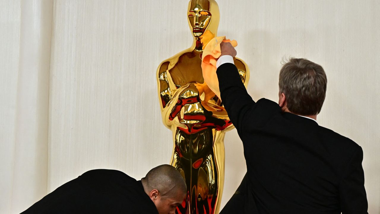 Workers polish the Oscar statue as celebrities attend the 96th Annual Academy Awards at the Dolby Theatre in Hollywood, California on March 10, 2024. (Photo by Frederic J. Brown / AFP) (Photo by FREDERIC J. BROWN/AFP via Getty Images)