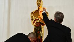 Workers polish the Oscar statue as celebrities attend the 96th Annual Academy Awards at the Dolby Theatre in Hollywood, California on March 10, 2024. (Photo by Frederic J. Brown / AFP) (Photo by FREDERIC J. BROWN/AFP via Getty Images)