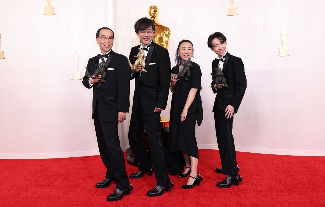 Winners of the Best Visual Effects award for "Godzilla Minus One," Masaki Takahashi, Takashi Yamazaki, Kiyoko Shibuya and Tatsuji Nojima matched in all-black ensembles. They all completed their looks with shoes featuring heels resembling Godzilla’s hands.