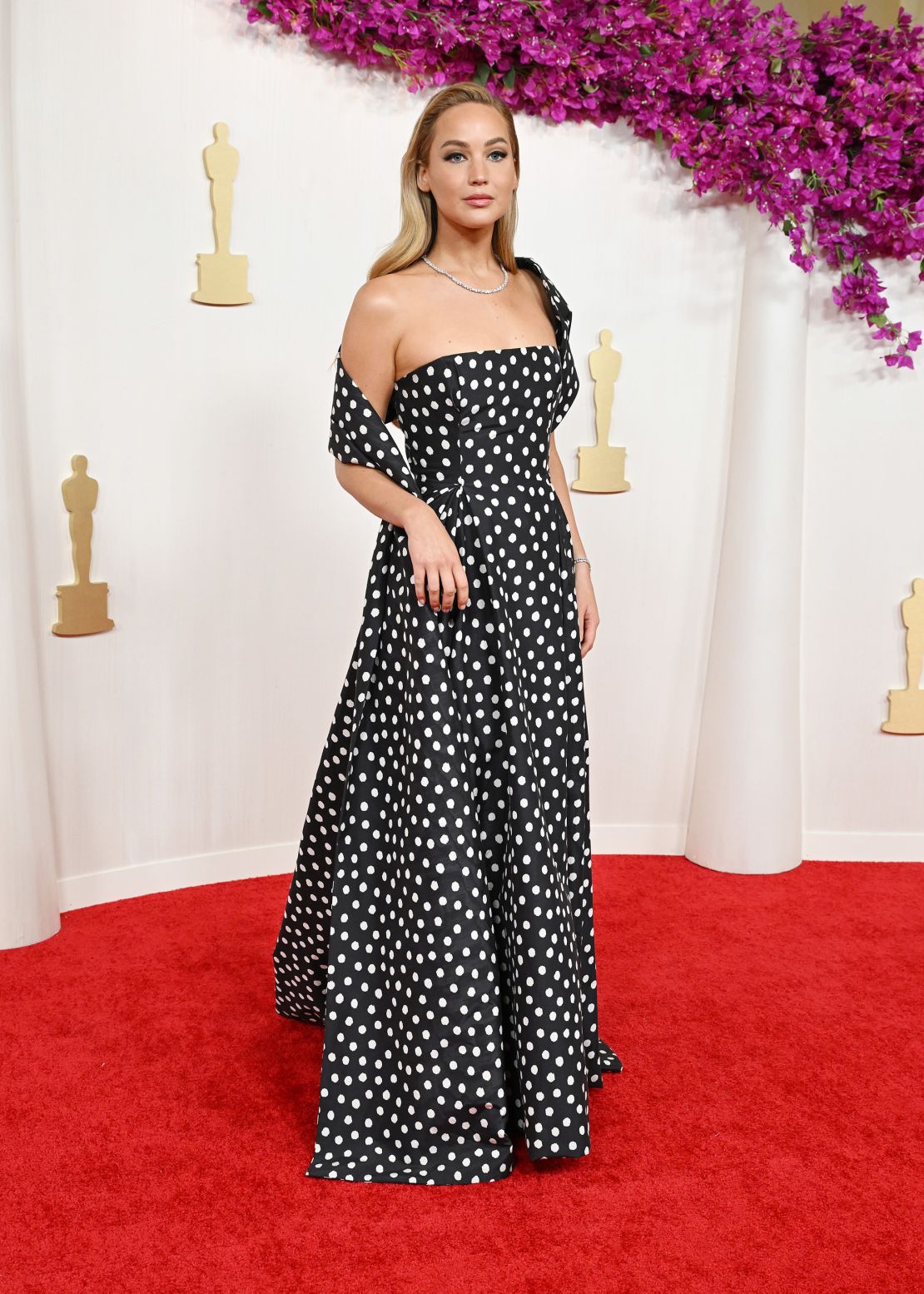 Jennifer Lawrence crossed the carpet in a retro polka-dot custom look by Christian Dior Haute Couture. Her Swarovski<strong> </strong>necklace and bracelet were made using lab-grown diamonds