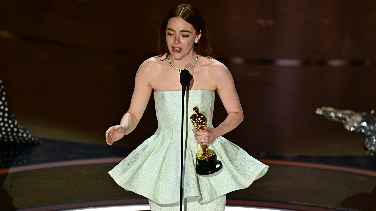 Emma Stone accepting the award for lead actress for 'Poor Things' at the 2024 Oscars in Hollywood.