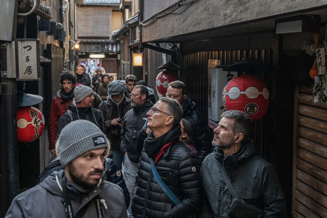 Travelers crowd the narrow streets of Gion, Kyoto.