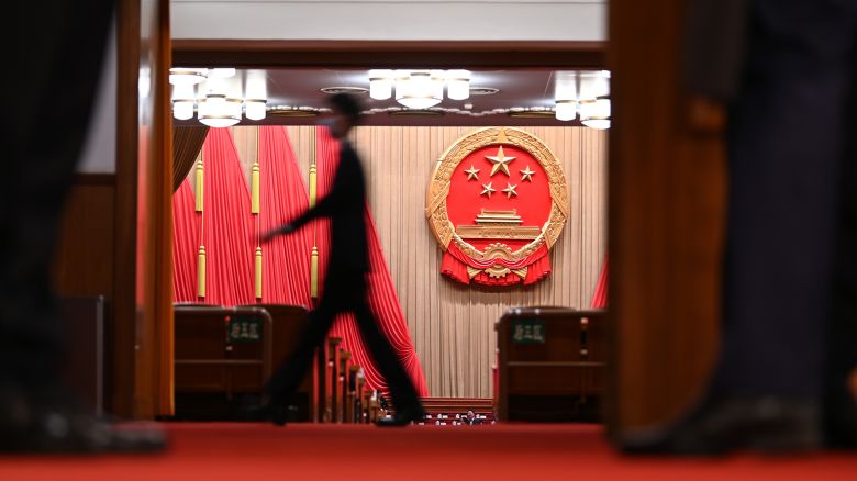A man walks through the plenary hall of the Great Hall of the People in Beijing, China on March 11, 2024.