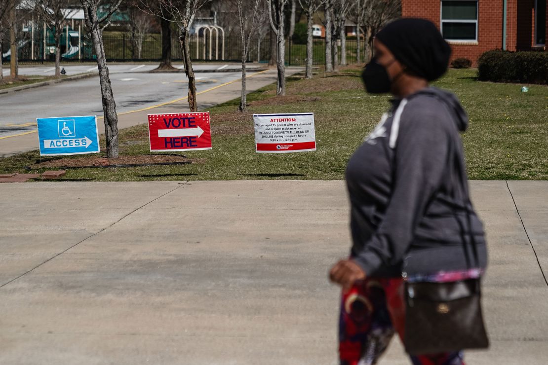 A voter leaves a polling place after casting a primary ballot in Atlanta, Georgia, on March 12, 2024.