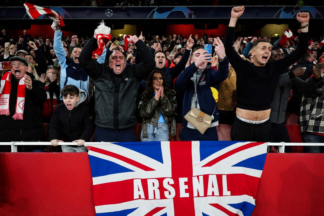 Arsenal fans celebrate during the penalty shootout.