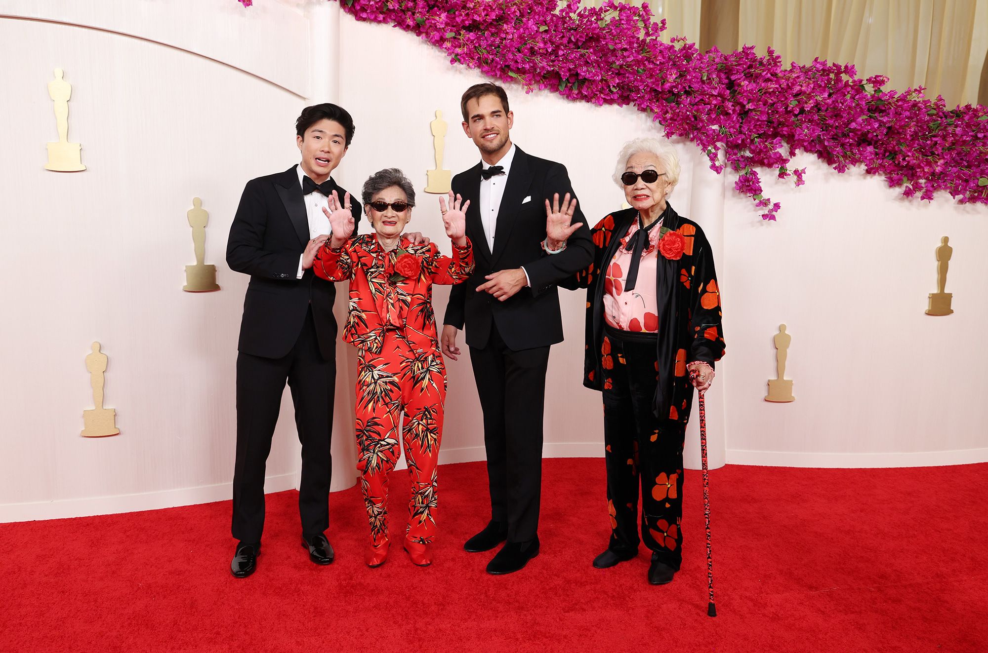 Sean Wang and Sam Davis, nominated for their short documentary “Nai Nai & Wai Po” (or “Grandma & Grandma”), pose alongside the film's subjects, Chang Li Hua and Yi Yan Fuei, who were wearing a custom Rodarte.