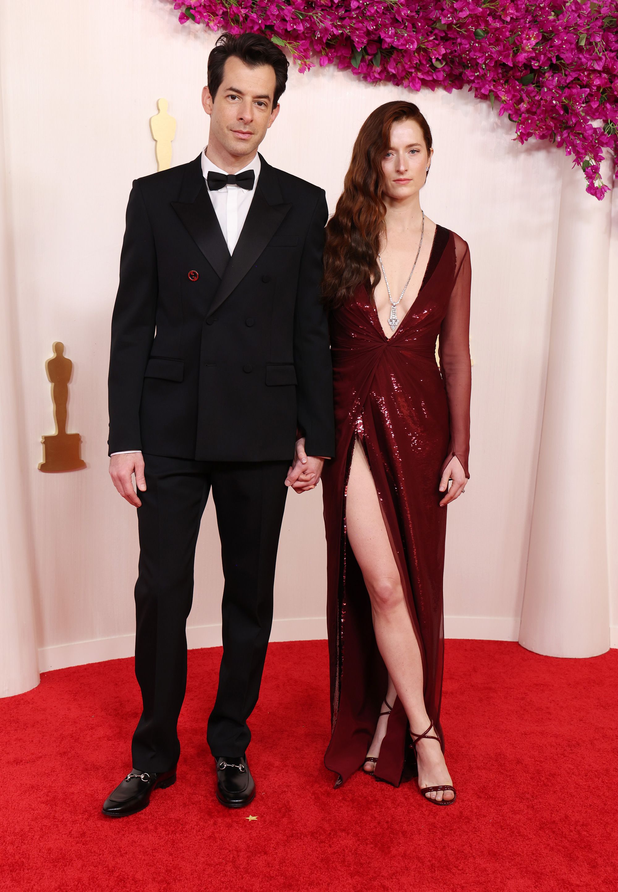 Best Original Song nominee (for “I'm Just Ken”) Mark Ronson wore a classic Gucci double-breasted suit.  His wife Grace Gummer opted for a low-cut red Gucci dress and Briony Raymond jewelry.