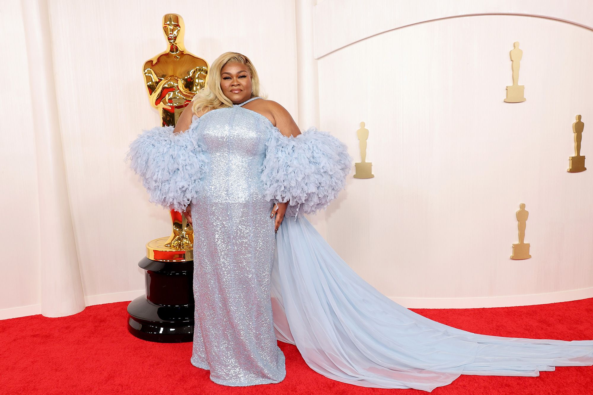 Da'Vine Joy Randolph, who went on to win the Oscar for Best Supporting Actress, wore a custom Louis Vuitton gown with hand-embroidered tulle and oversized fringe sleeves.