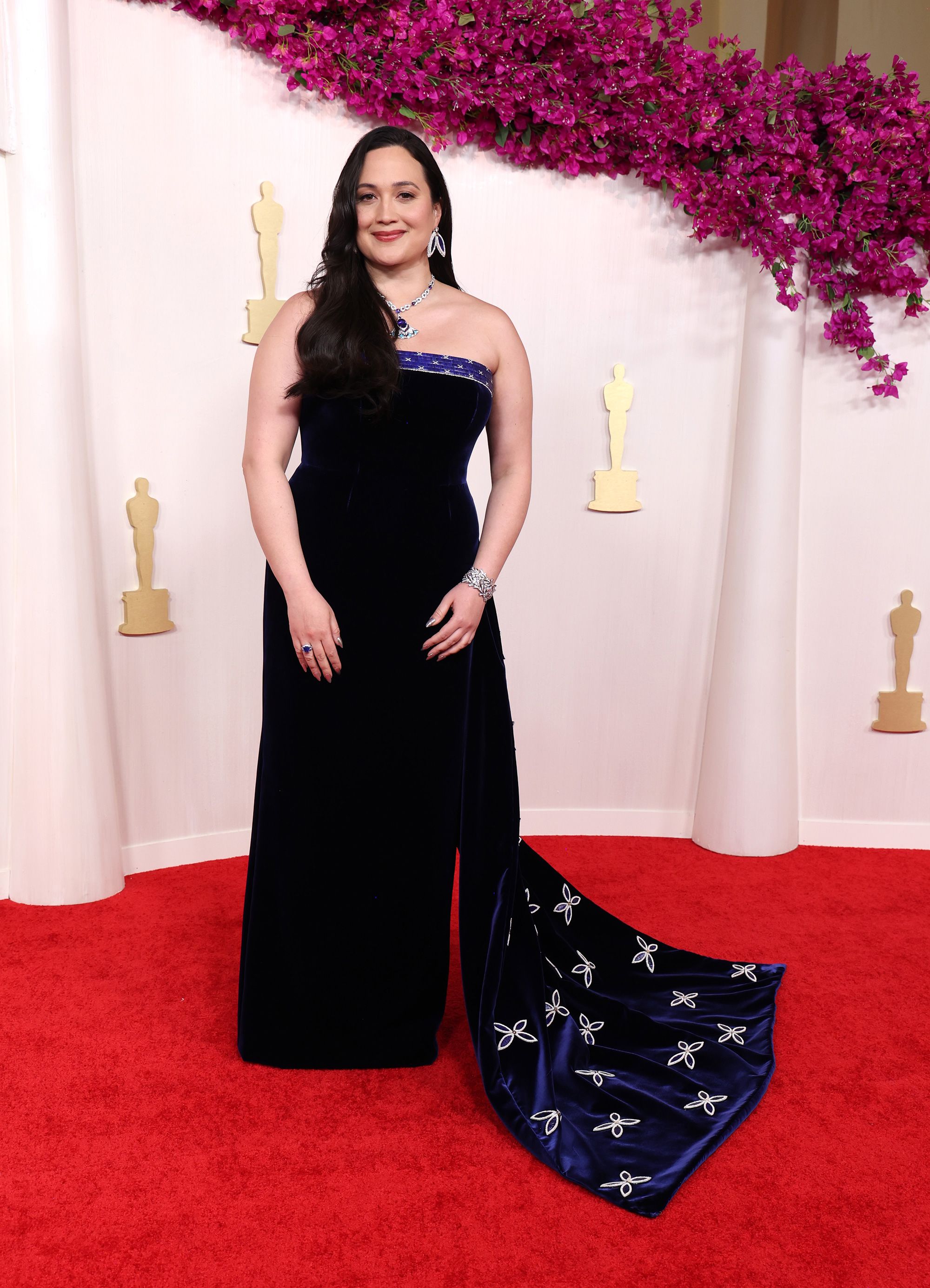 Lily Gladstone, nominated as Best Actress for "Killers of the Flower Moon,” paid tribute to Native American design in a blue velvet Gucci gown that was created in collaboration with Indigenous artist Joe Big Mountain.