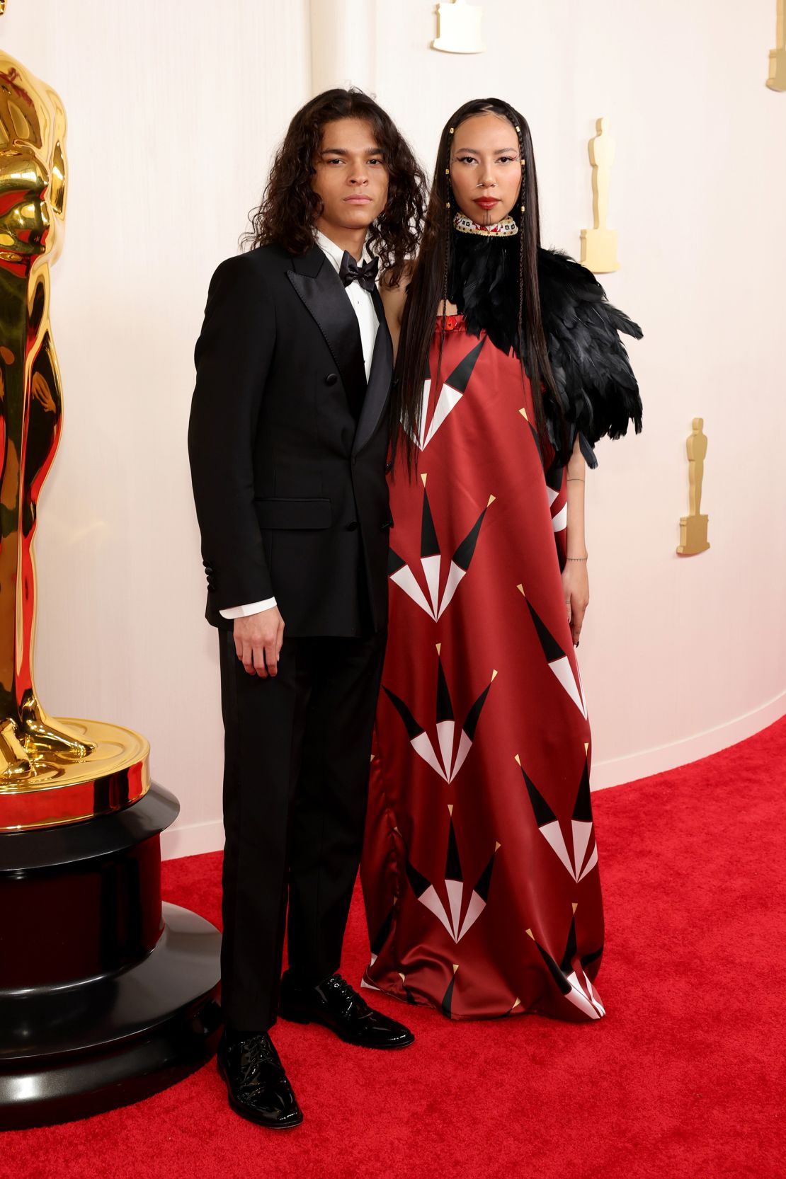 "Reservation Dogs" actor D'Pharaoh Woon-A-Tai wore a double-breasted Dolce & Gabbana suit, while model and activist Quannah Chasinghorse opted for a look by Native American fashion line Red Berry Woman.