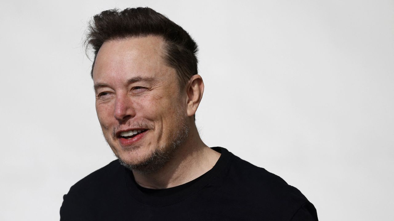 Tesla CEO Elon Musk is pictured during a visit at the company's electric car plant in Gruenheide near Berlin, eastern Germany, on March 13, 2024, as employees resumed work after production had to be halted due to a suspected arson attack that caused a power outage. Damage to the lines knocked out power to the plant as well as cutting electricity to surrounding villages since power lines supplying the factory were set on fire in the early hours of March 5, 2024. Far-left activists from the "Vulkangruppe" (Volcano Group) have claimed responsibility for the sabotage, saying they aimed to achieve "the biggest possible blackout of the gigafactory", a reference to the Tesla plant.