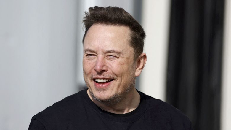 Tesla CEO Elon Musk is pictured during a visit at the company's electric car plant in Gruenheide near Berlin, eastern Germany, on March 13, 2024, as employees resumed work after production had to be halted due to a suspected arson attack that caused a power outage. Damage to the lines knocked out power to the plant as well as cutting electricity to surrounding villages since power lines supplying the factory were set on fire in the early hours of March 5, 2024. Far-left activists from the "Vulkangruppe" (Volcano Group) have claimed responsibility for the sabotage, saying they aimed to achieve "the biggest possible blackout of the gigafactory", a reference to the Tesla plant. (Photo by Odd ANDERSEN / AFP) (Photo by ODD ANDERSEN/AFP via Getty Images)