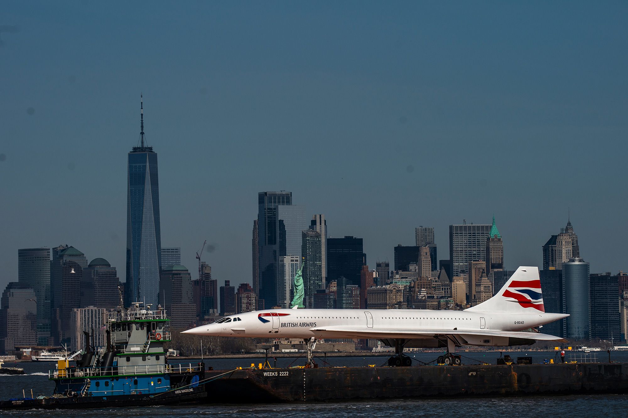 A retired British Airways Concorde has been making its way down the Hudson River on a barge.