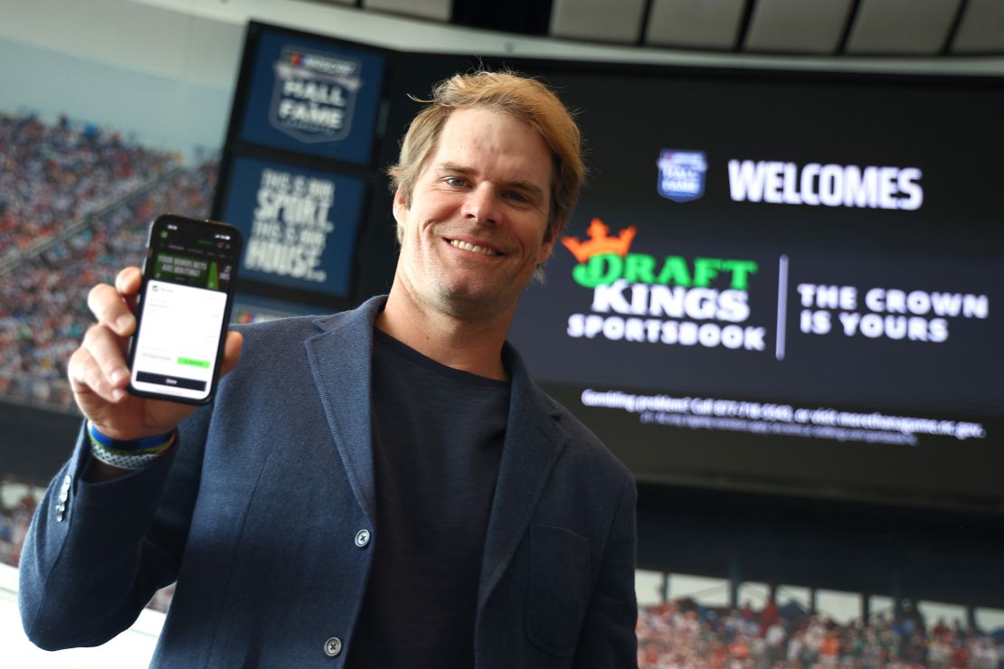 Former NFL tight end and sportscaster Greg Olsen shows the first bet placed during the DraftKings First Bet in North Carolina at NASCAR Hall of Fame in March.