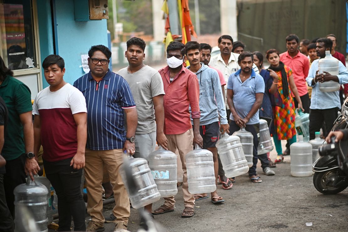 People line up to collect drinking water during the ongoing crisis in Bengaluru on March 14, 2024.