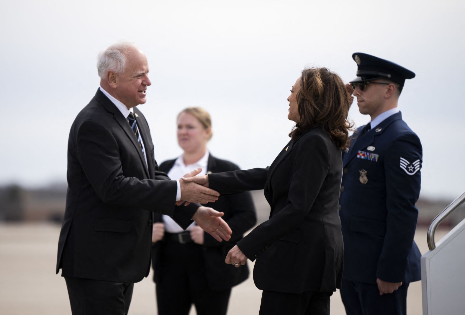 Walz greets Vice President Kamala Harris as she arrives in Minneapolis in March 2024.