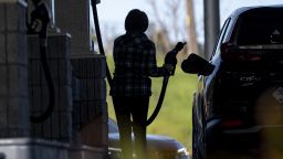 A customer pumps gas at a gas station in Hercules, California, US, on Thursday, March 14, 2024.