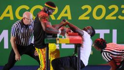 Ghana's Prince Affum (L) competes against Nigeria's Samual Nneka (R) in the Senior Men's 85 KG left arm wrestling competition during the 2023 African Games in Accra, Ghana, on March 15, 2024. The 13th edition of the African Games runs in Ghana until March 23, 2024. (Photo by Nipah Dennis / AFP) (Photo by NIPAH DENNIS/AFP via Getty Images)
