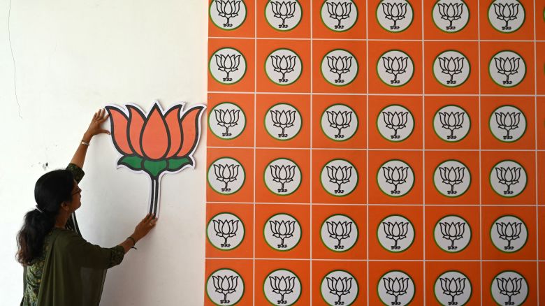 A woman places a Bharatiya Janata Party (BJP) symbol at a BJP election office in Chennai on March 16.