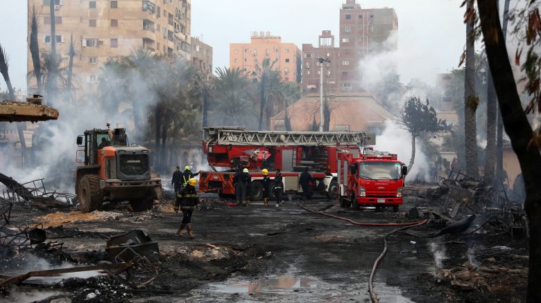 Firefighters cool the area still smouldering after a fire at the Al-Ahram Studio and surrounding buildings in Cairo's Giza district on March 16, 2024. Flames overtook one of the Arab world's most prestigious and oldest film production studios founded 80 years ago, burning everything inside and spreading to three surrounding buildings which were evacuated before the blaze reached them. (Photo by Momen SAMIR / AFP) (Photo by MOMEN SAMIR/AFP via Getty Images)