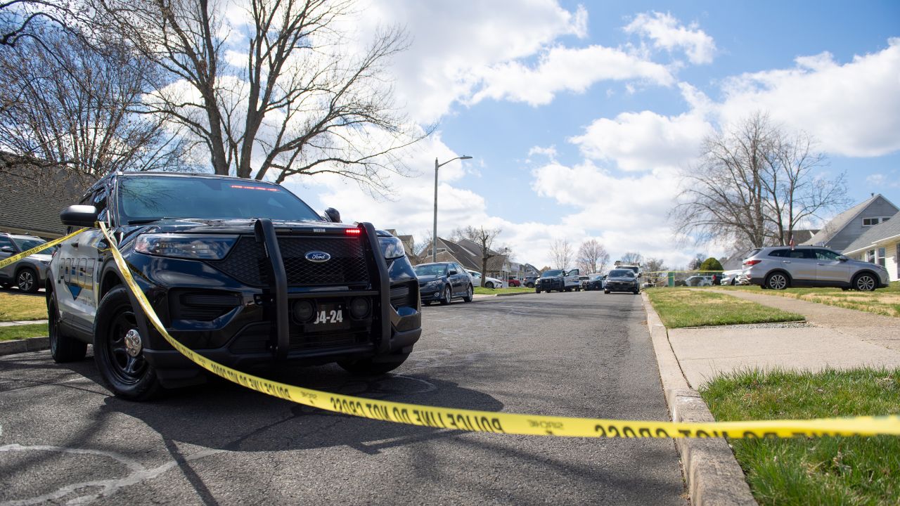 LEVITTOWN, PENNSYLVANIA - MARCH 16: Police officers from the Falls Township Police Department tape off and inspect the scene of one of three shootings in the Vermillion Hills neighborhood on March 16, 2024 in Levittown, Pennsylvania. The suspect shot and killed three people in Levittown before fleeing to Trenton, New Jersey where he barricaded himself in a home with hostages. (Photo by Matthew Hatcher/Getty Images)