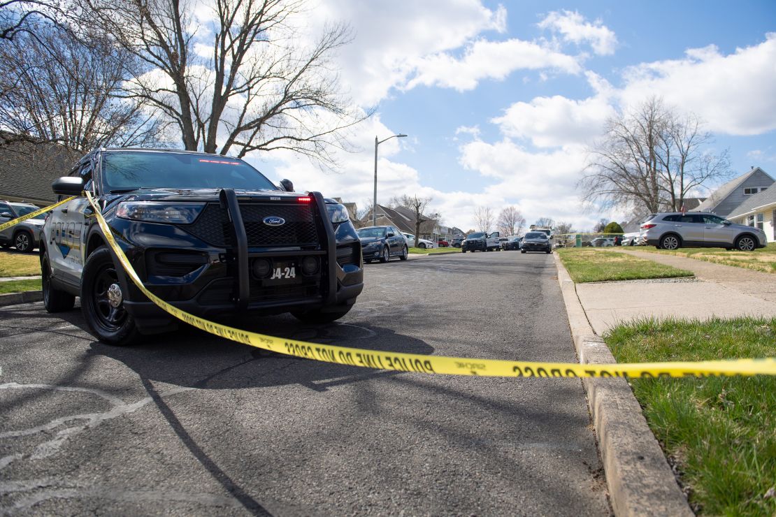 Police officers from the Falls Township Police Department inspect the scene of a shooting in the Vermillion Hills neighborhood on March 16, 2024, in Levittown, Pennsylvania.