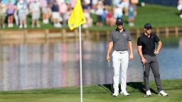 PONTE VEDRA BEACH, FLORIDA - MARCH 14: Jordan Spieth of the United States and Rory McIlroy of Northern Ireland look on from the 16th green during the first round of THE PLAYERS Championship on the Stadium Course at TPC Sawgrass on March 14, 2024 in Ponte Vedra Beach, Florida. (Photo by Mike Ehrmann/Getty Images)