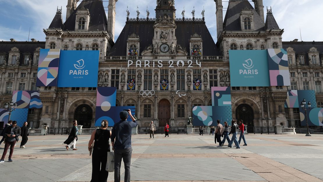 PARIS, FRANCE - MARCH 14:  The Paris 2024 logo, representing the Olympic and Paralympic Games four months prior to the start of the Paris 2024 Olympic and Paralympic games is displayed on the facade of Paris town hall on March 14, 2024 in Paris, France. The city is gearing up to host the XXXIII Olympic and Paralympic Summer Games, from 26 July to 11 August. (Photo by Pascal Le Segretain/Getty Images)