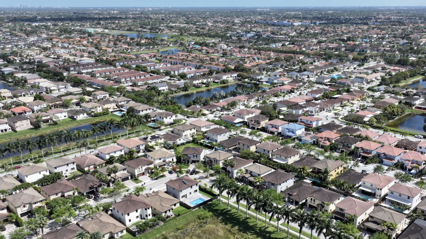 The current real estate business model is poised for a dramatic change. Homes sit on lots in a residential neighborhood on March 15, 2024, in Miami, Florida.