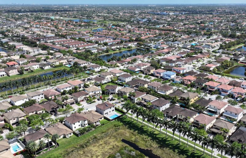 MIAMI, FLORIDA - MARCH 15: In an aerial view, homes sit on lots in a residential neighborhood on March 15, 2024, in Miami, Florida. The National Association of Realtors announced that it had reached a nationwide settlement of claims that the industry had conspired to keep agent commissions high. As part of the settlement, the National Association of Realtors did not admit wrongdoing but agreed to pay $418 million over the next four years. (Photo by Joe Raedle/Getty Images)